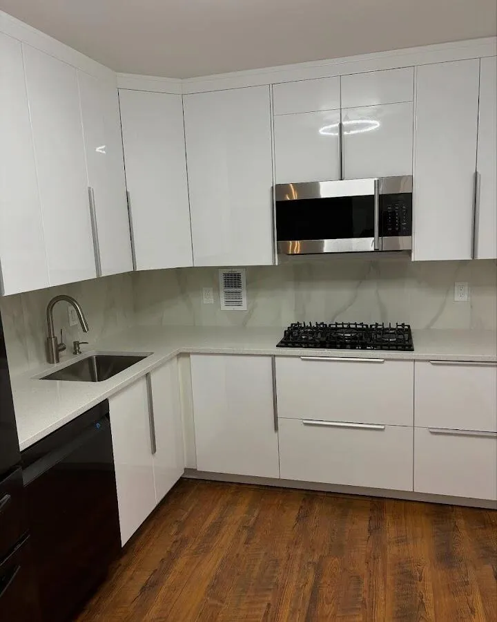 Restored kitchen with white cabinets after water damage in Fruitville